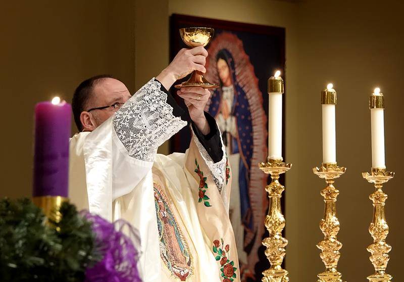 Father John Putnam, pastor, offered a bilingual Mass, wearing a new chasuble given to him by the Hispanic Ministry for his recent birthday.