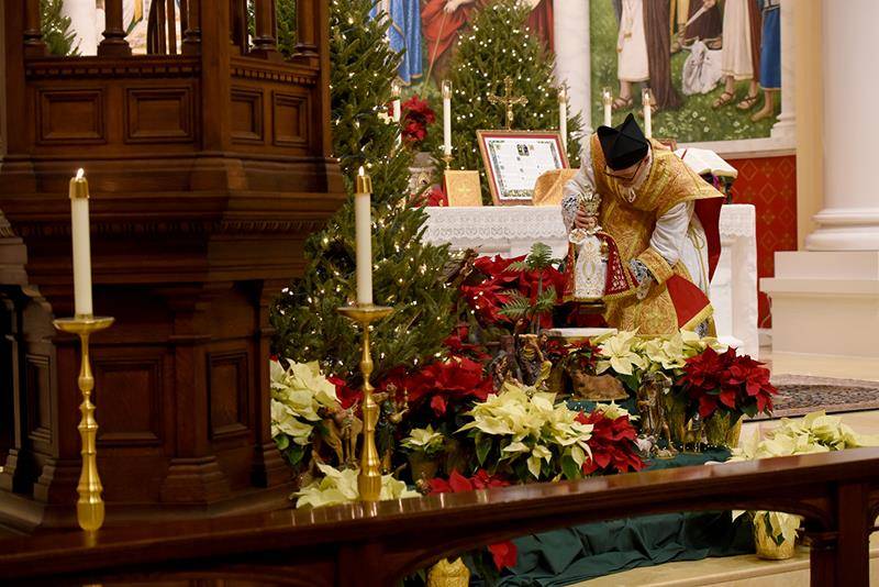 CHARLOTTE — St. Ann Parish celebrated Midnight Christmas Mass in the Extraordinary Form (Latin) with pastor Father Timothy Reid early Tuesday morning Dec. 25. (Mike FitzGerald and Markus Kuncoro | Catholic News Herald)