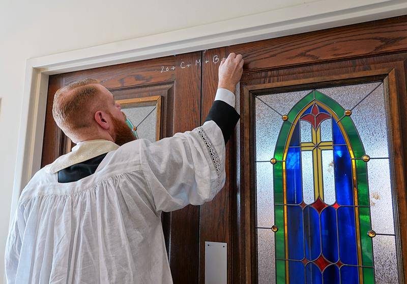 St. Mark Parish in Huntersville organized A blessing of Epiphany water, salt and chalk Jan. 5 with Father John Putnam, pastor, and Father Noah Carter and Father Brian Becker, parochial vicars, who were also joined by CKHS chaplain, Father Paul McNulty.