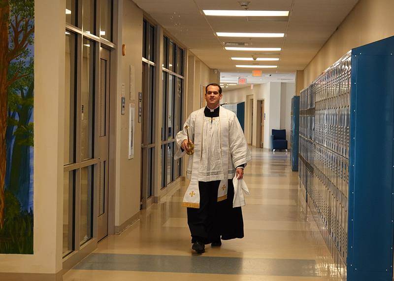 After the blessing the priests then proceeded to chalk every door of the church and the parish hall, as well as St. Mark School and Christ the King High School. Each building was also blessed with holy water and censed.