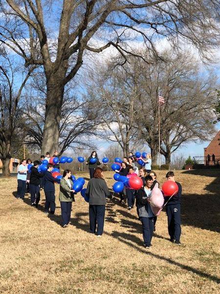 WINSTON – SALEM — Our Lady of Mercy students pray a living rosary followed by releasing it to rise like incense to the heavens. (Photo provided by Katrina Capistrano)
