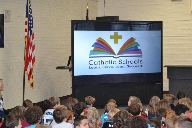 CHARLOTTE — St. Ann School started Catholic Schools Week with a prayer service on Jan. 28. The annual teachers vs. Fifth Grade students volleyball game followed. Teachers won the first game and students won the second. (Photo via Facebook)