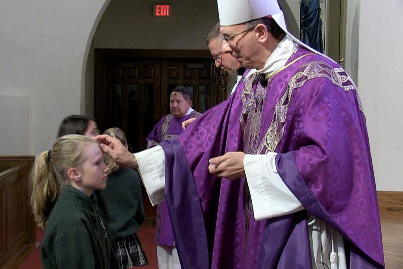 CHARLOTTE — Bishop Peter Jugis and Father Christopher Roux celebrated Mass on Ash Wednesday at St. Patrick Cathedral. Students from St. Patrick School attended. (Photo by César Hurtado)