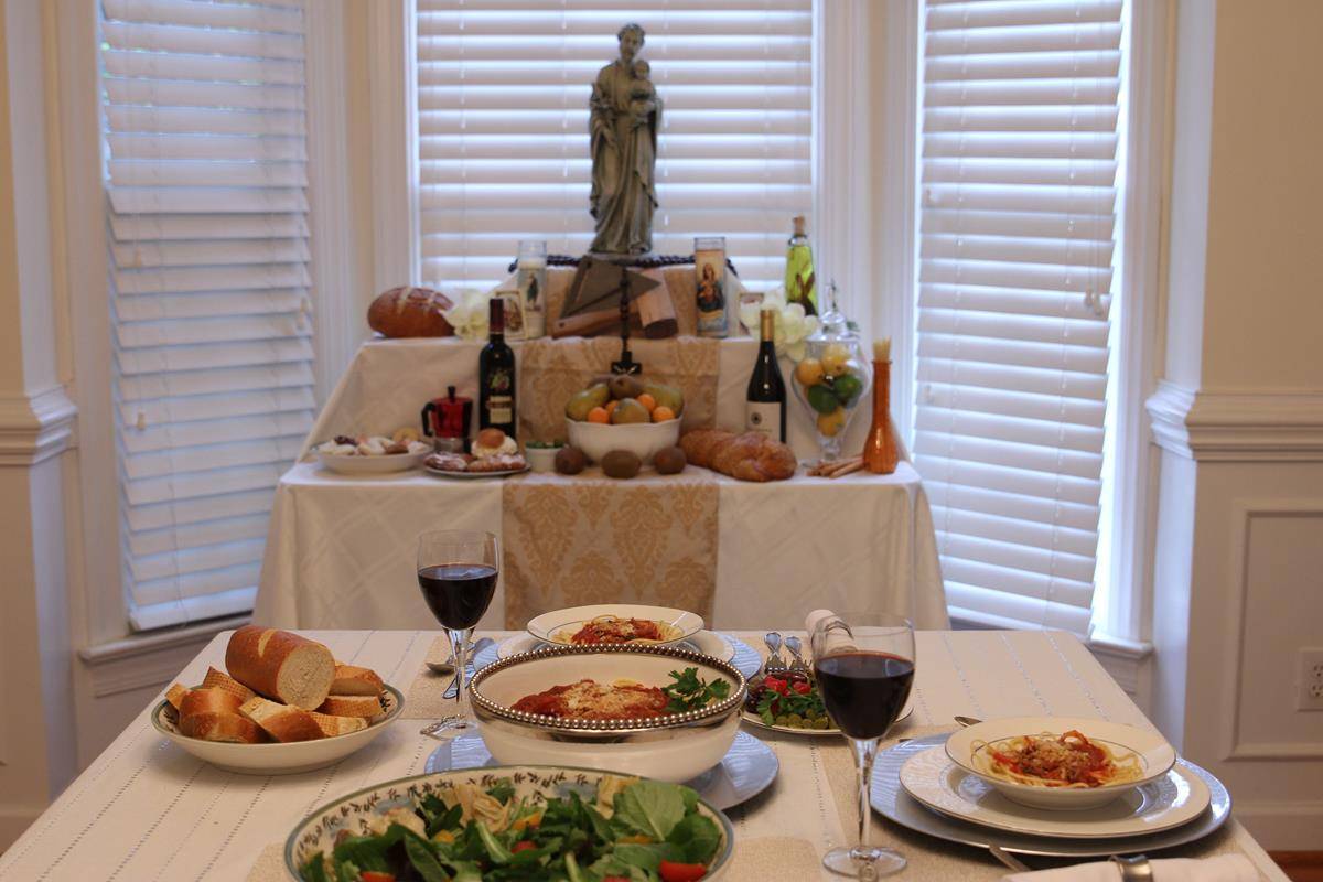 Table set with food and altar in background.