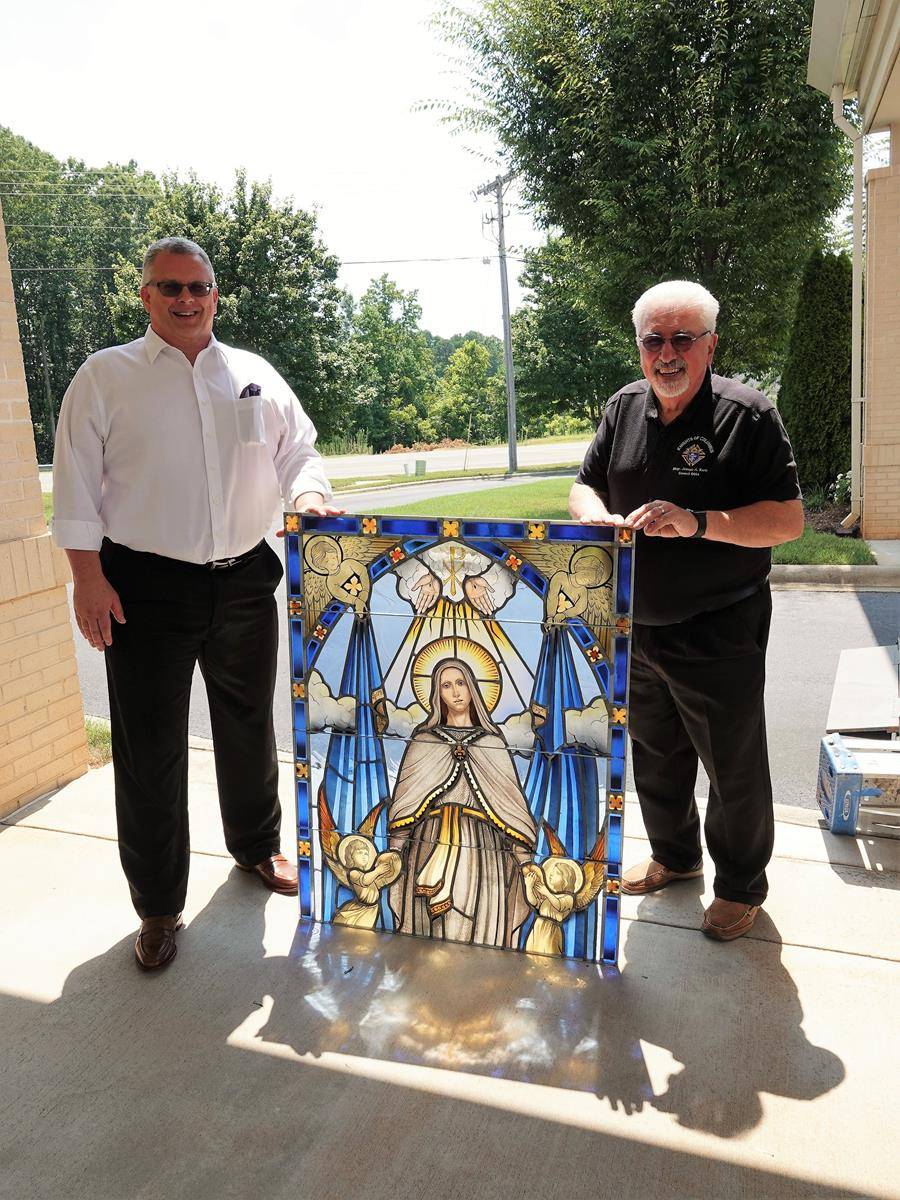 Showing off the new windows at St. Mark Church.