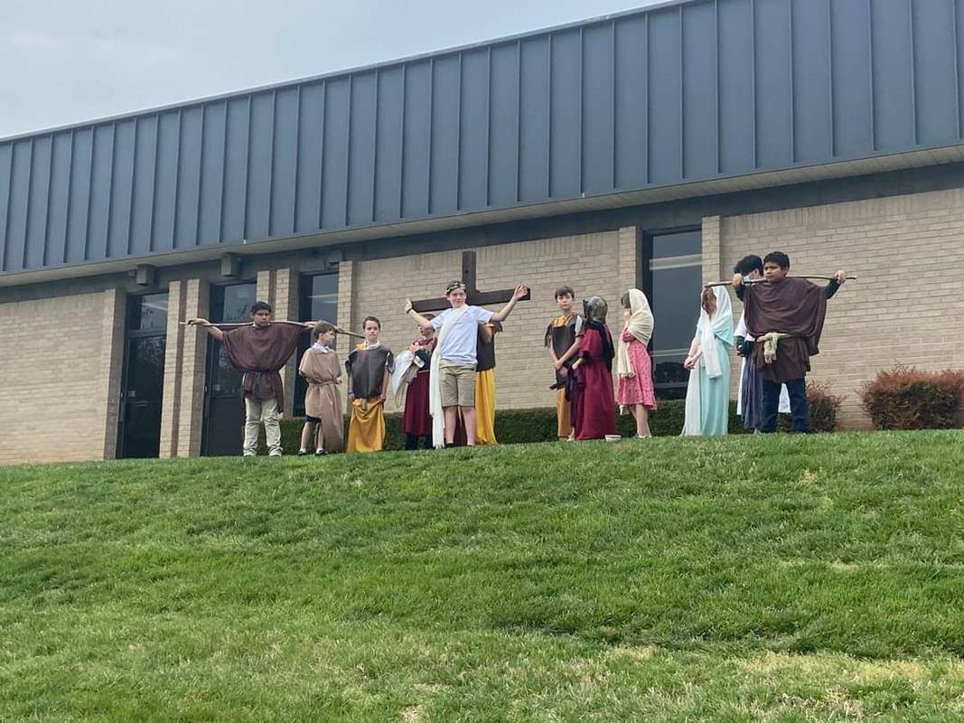 St. Michael School third and sixth grade classes performed a Living Stations of the Cross. (Photo via Facebook)