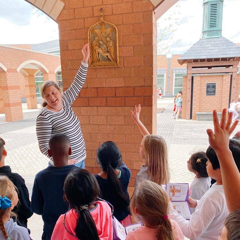 First grade students at Immaculate Heart of Mary School have been praying the Stations of the Cross every Friday during Lent. At each station, they recall and meditate on a specific event from Christ's last day. (Photo via Facebook)
