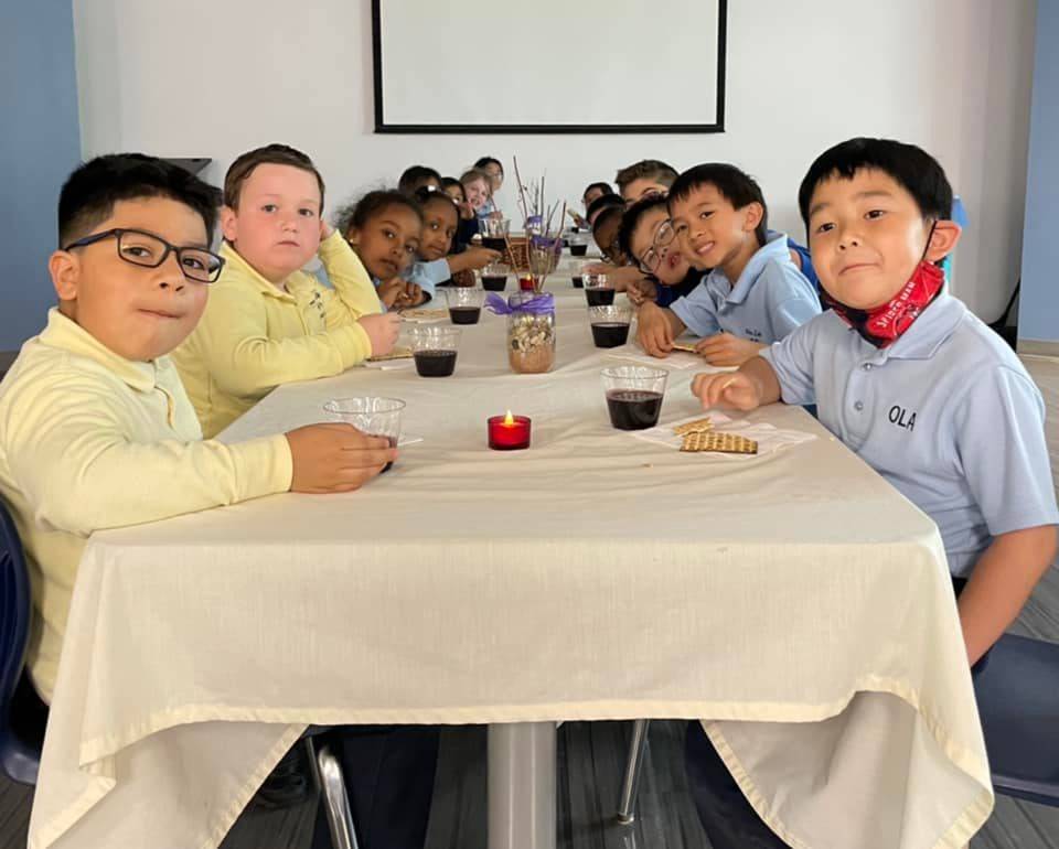 Our Lady of the Assumption School students prepare for Easter by reenacting The Last Supper. (Photo via Facebook)